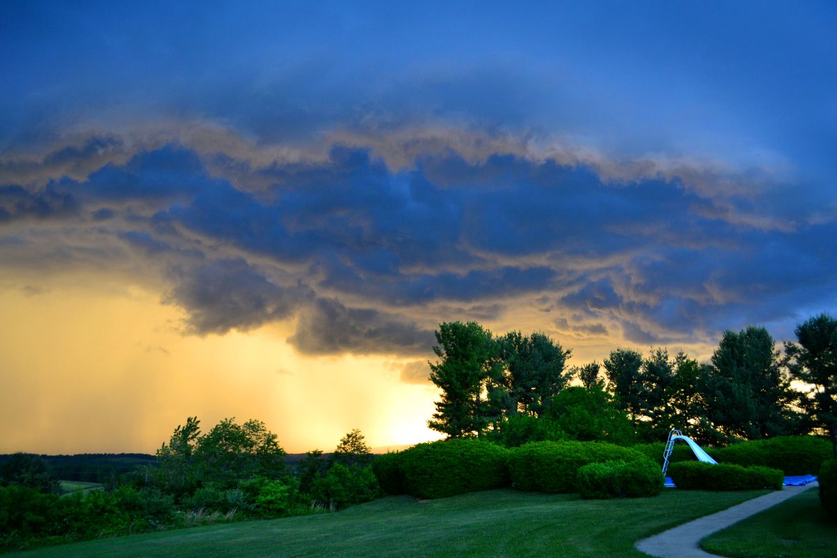 summer thunderstorm over Alberta homes