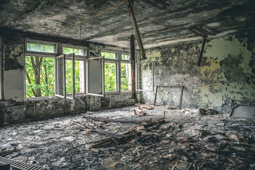 restoration crew boarding up windows after a house fire in Central Alberta